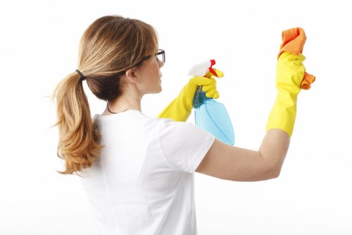 Technician inspecting a carpet cleaning area for hazards